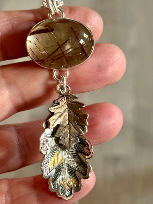 Rutilated Quartz Pendant with Hand Engraved Leaves