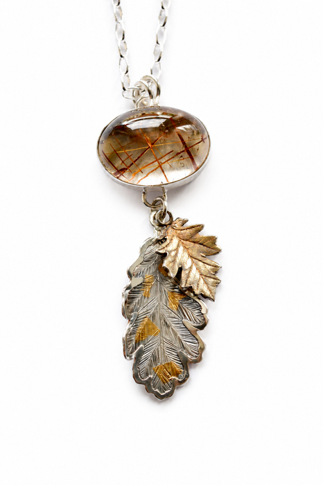 Rutilated Quartz Pendant with Hand Engraved Leaves