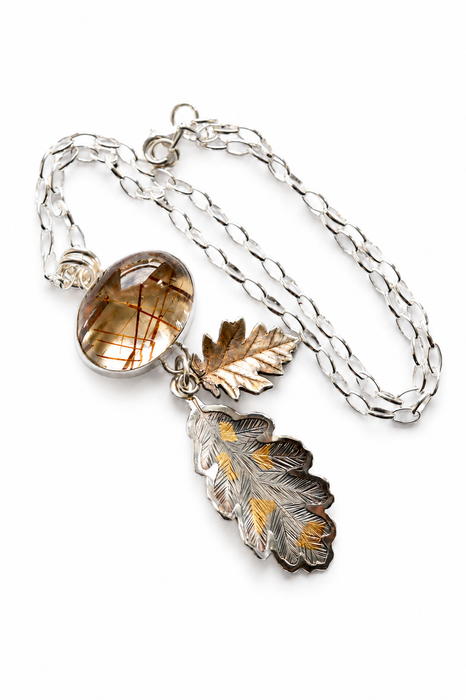 Rutilated Quartz Pendant with Hand Engraved Leaves