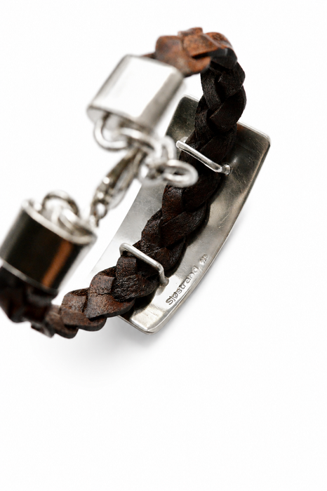 Hand engraved silver feather leather cuff